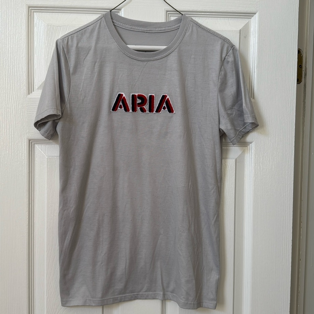 Men’s ARIA casino tee shirt. Light gray with chenille and felt logo. Size small.